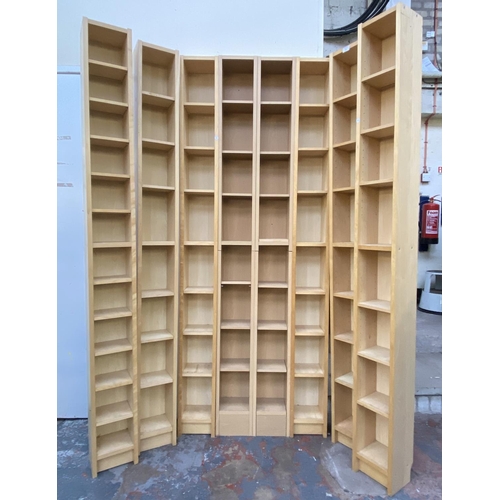 121 - Eight IKEA beech effect CD racks - approx. 202cm high x 20cm wide x 17cm deep