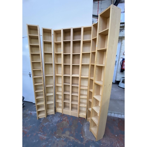 121 - Eight IKEA beech effect CD racks - approx. 202cm high x 20cm wide x 17cm deep