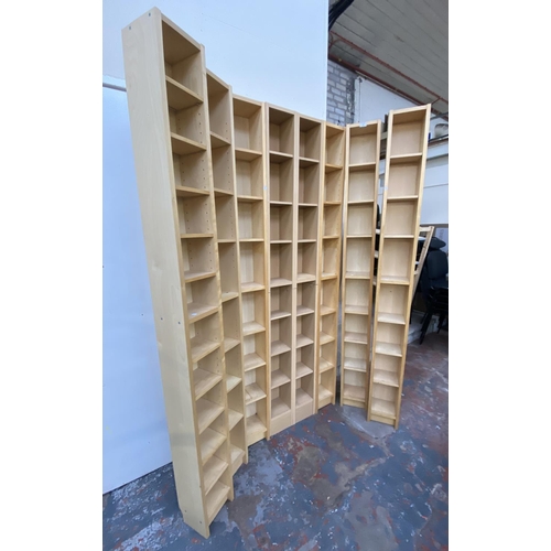 121 - Eight IKEA beech effect CD racks - approx. 202cm high x 20cm wide x 17cm deep