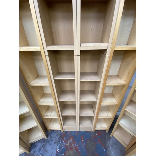 121 - Eight IKEA beech effect CD racks - approx. 202cm high x 20cm wide x 17cm deep