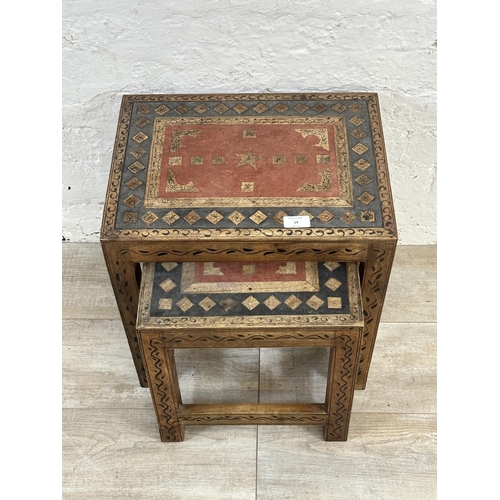 14 - A Middle Eastern hand painted and inlaid hardwood nest of two tables - approx. 44cm high x 43cm wide... 