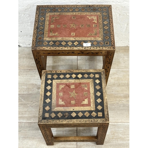 14 - A Middle Eastern hand painted and inlaid hardwood nest of two tables - approx. 44cm high x 43cm wide... 