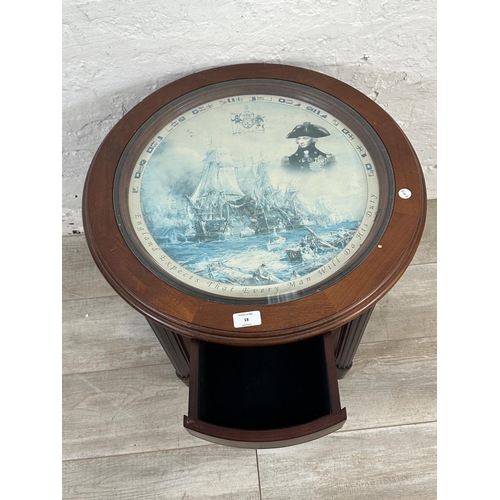 18 - A Danbury Mint The Trafalgar mahogany and glass circular side table - approx. 56cm high x 56cm diame... 