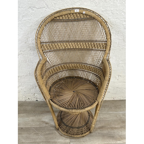 19 - A mid 20th century wicker peacock chair - approx. 113cm high x 69cm wide x 49cm deep