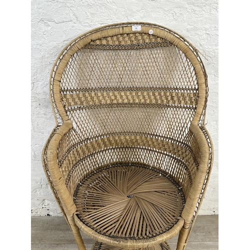 19 - A mid 20th century wicker peacock chair - approx. 113cm high x 69cm wide x 49cm deep