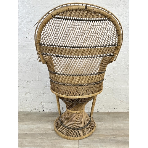 19 - A mid 20th century wicker peacock chair - approx. 113cm high x 69cm wide x 49cm deep