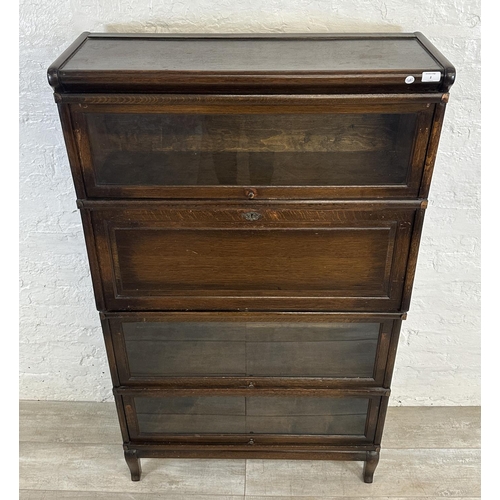 2 - An early 20th century Globe-Wernicke oak four section stacking bookcase - approx. 147cm high x 86cm ... 