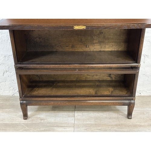 2 - An early 20th century Globe-Wernicke oak four section stacking bookcase - approx. 147cm high x 86cm ... 