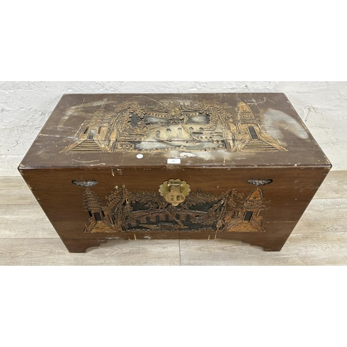 20 - A Chinese carved camphor wood blanket box - approx. 50cm high x 91cm wide x 45cm deep