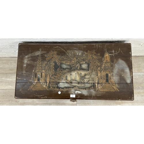 20 - A Chinese carved camphor wood blanket box - approx. 50cm high x 91cm wide x 45cm deep