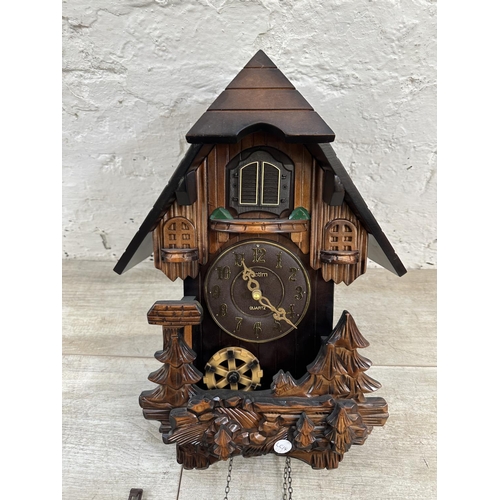 21 - Two clocks, one Bentima walnut cased eight day battery powered mantel clock - approx. 21cm high and ... 