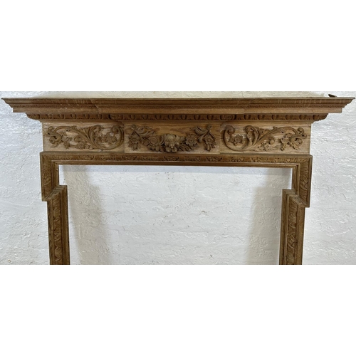 22 - A 19th century style carved pine fire surround - approx. 146cm high x 152cm wide x 24cm deep