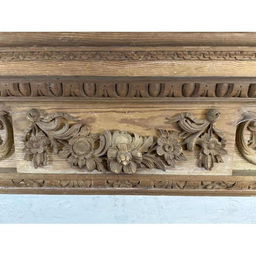 22 - A 19th century style carved pine fire surround - approx. 146cm high x 152cm wide x 24cm deep