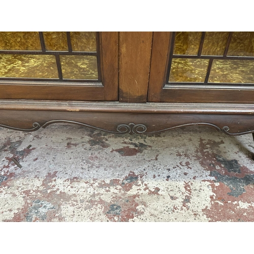 25 - A Victorian carved mahogany display cabinet - approx. 114cm high x 135cm wide x 42cm deep