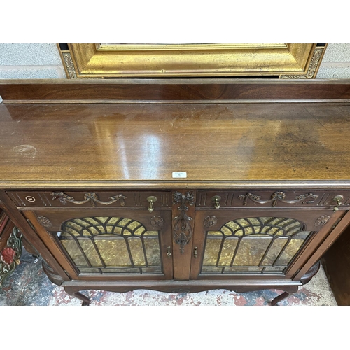 25 - A Victorian carved mahogany display cabinet - approx. 114cm high x 135cm wide x 42cm deep