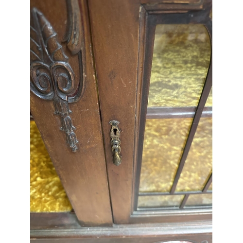 25 - A Victorian carved mahogany display cabinet - approx. 114cm high x 135cm wide x 42cm deep