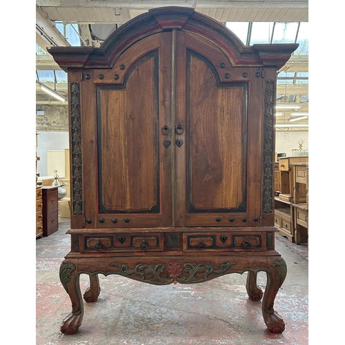 26 - A Chinese hand painted and carved hardwood two door cabinet - approx. 199cm high x 150cm wide x 59cm... 