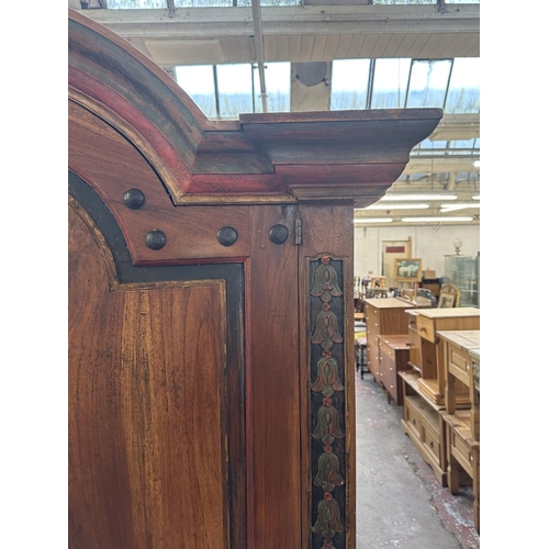 26 - A Chinese hand painted and carved hardwood two door cabinet - approx. 199cm high x 150cm wide x 59cm... 