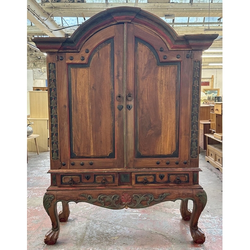 26 - A Chinese hand painted and carved hardwood two door cabinet - approx. 199cm high x 150cm wide x 59cm... 