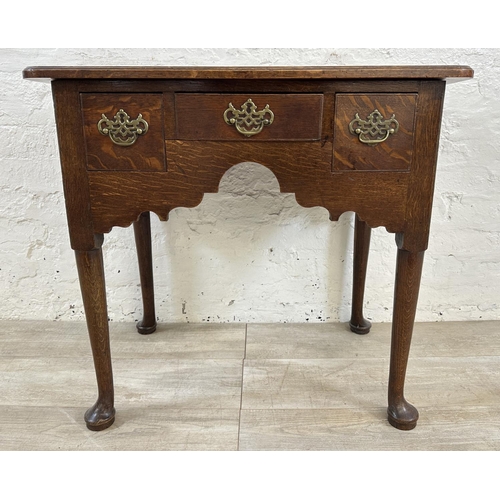 31 - A George III oak lowboy - approx. 71cm high x 76cm wide x 47cm deep