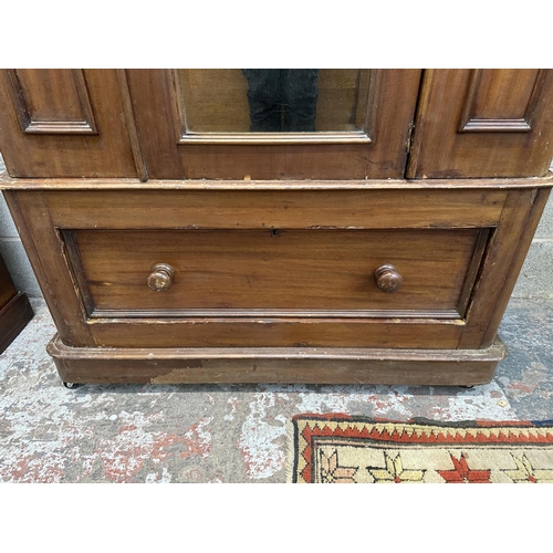 32 - A Victorian mahogany mirror door wardrobe - approx. 208cm high x 121cm wide x 50cm deep