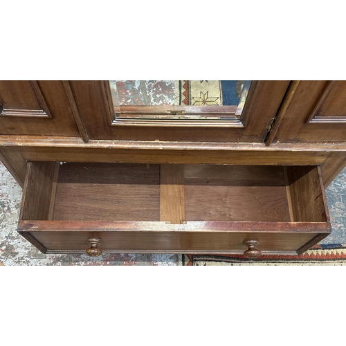 32 - A Victorian mahogany mirror door wardrobe - approx. 208cm high x 121cm wide x 50cm deep