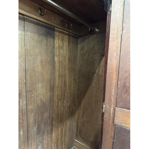 32 - A Victorian mahogany mirror door wardrobe - approx. 208cm high x 121cm wide x 50cm deep