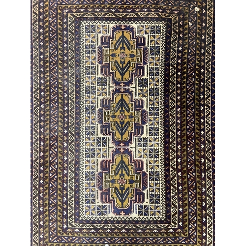 37 - An Afghan blue ground rug - approx. 150cm x 95cm