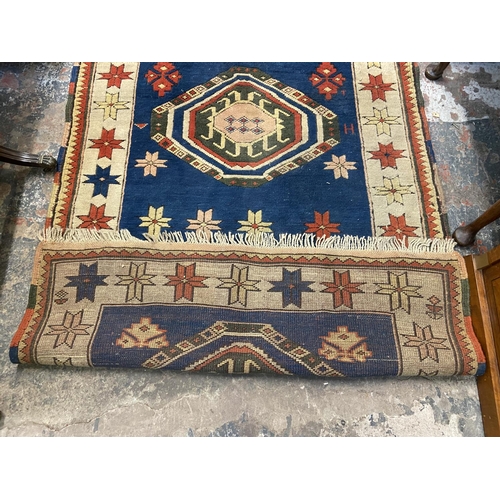 38 - A mid 20th century hand knotted rug - approx. 180cm x 130cm