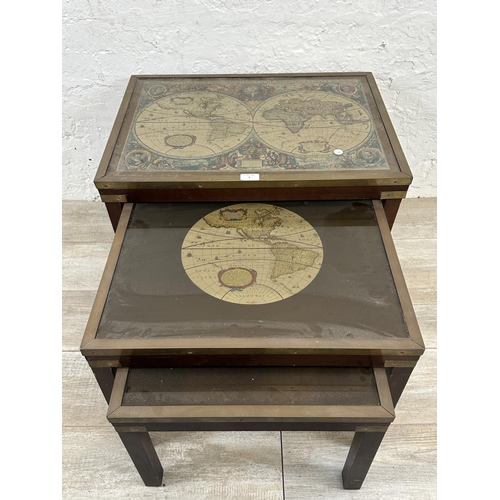 4 - A mid 20th century mahogany and brass nest of three tables with map of the world design - approx. 46... 