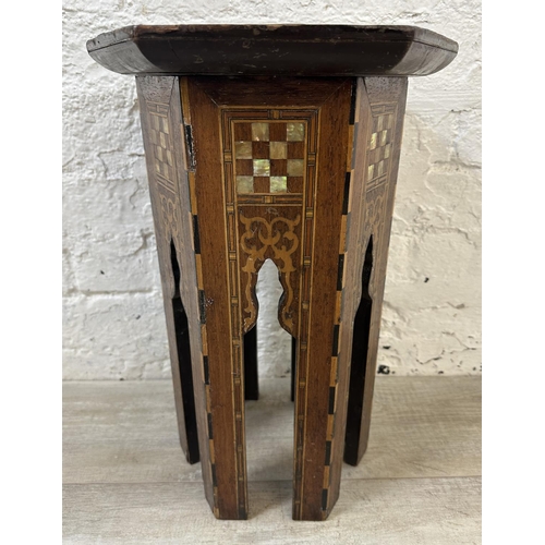 40 - A late 19th/early 20th century Moorish inlaid hardwood hexagonal side table - approx. 47cm high x 33... 