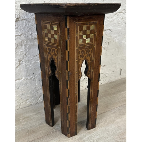 40 - A late 19th/early 20th century Moorish inlaid hardwood hexagonal side table - approx. 47cm high x 33... 