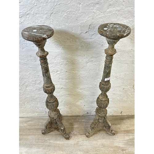 41 - A pair of 19th century style aged terracotta tripod pedestal torchères - approx. 98cm high