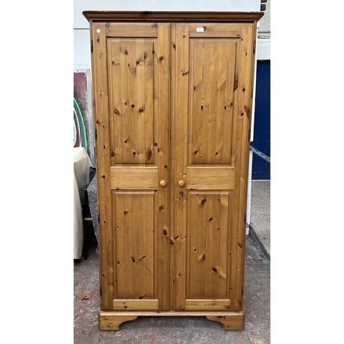 46 - A pine double wardrobe - approx. 192cm high x 98cm wide x 60cm deep