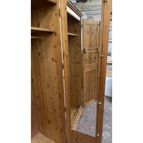 46 - A pine double wardrobe - approx. 192cm high x 98cm wide x 60cm deep