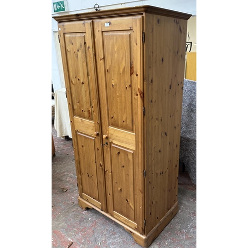 46 - A pine double wardrobe - approx. 192cm high x 98cm wide x 60cm deep