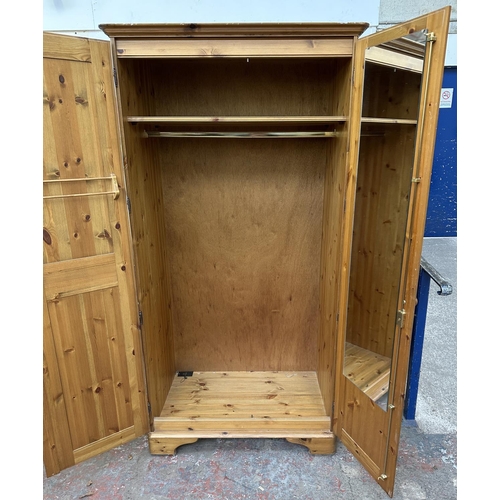 46 - A pine double wardrobe - approx. 192cm high x 98cm wide x 60cm deep