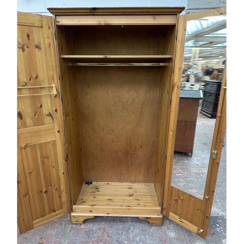 46 - A pine double wardrobe - approx. 192cm high x 98cm wide x 60cm deep