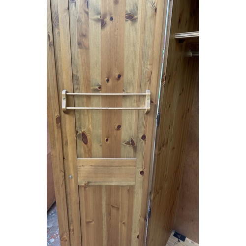 46 - A pine double wardrobe - approx. 192cm high x 98cm wide x 60cm deep