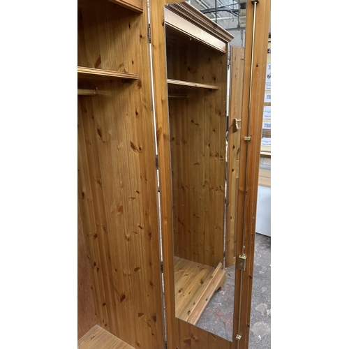 46 - A pine double wardrobe - approx. 192cm high x 98cm wide x 60cm deep