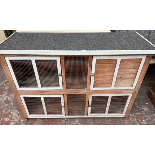 47 - A wooden two tier rabbit hutch - approx. 113cm high x 152cm wide x 61cm deep