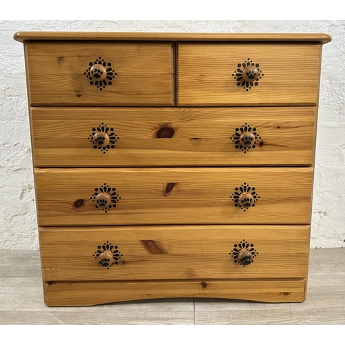 48 - A pine chest of drawers with dog design - approx. 74cm high x 80cm wide x 39cm deep