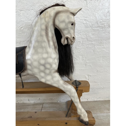 5 - A Victorian style hand painted carved hardwood rocking horse on pine stand - approx. 108cm high x 54... 