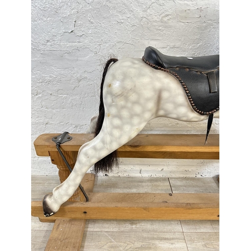 5 - A Victorian style hand painted carved hardwood rocking horse on pine stand - approx. 108cm high x 54... 