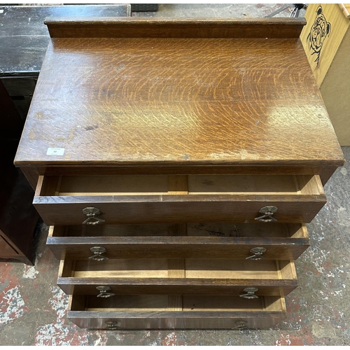 50 - An Art Deco oak chest of drawers - approx. 81cm high x 76cm wide x 48cm deep