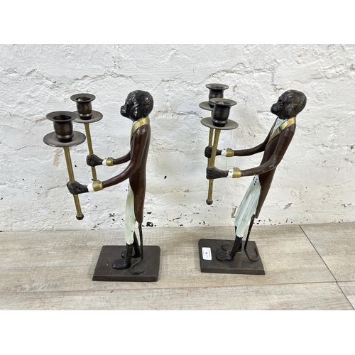 56 - A pair of Indian hand painted cast metal butler monkey twin branch candelabras - approx. 41cm high