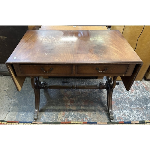 59 - Two Regency style mahogany drop leaf sofa tables - largest approx. 73cm high x 144cm wide x 54cm dee... 