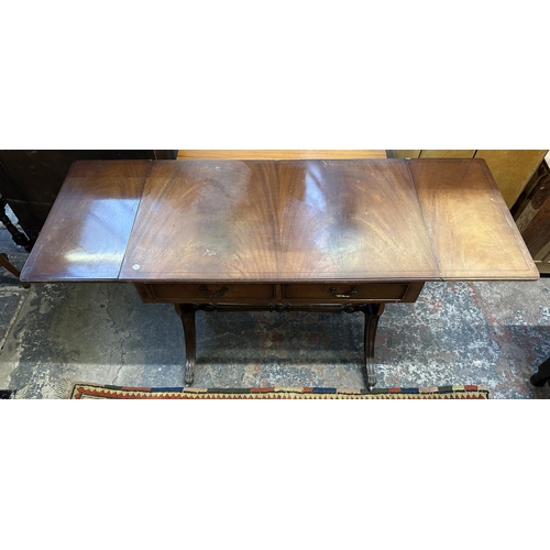 59 - Two Regency style mahogany drop leaf sofa tables - largest approx. 73cm high x 144cm wide x 54cm dee... 