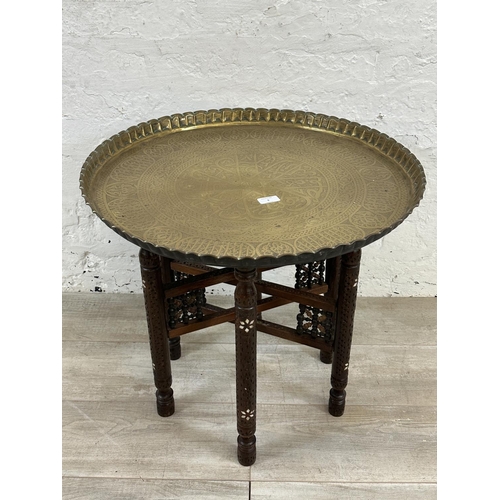 6 - A Middle Eastern inlaid carved hardwood folding travel table with engraved brass charger/tray - appr... 