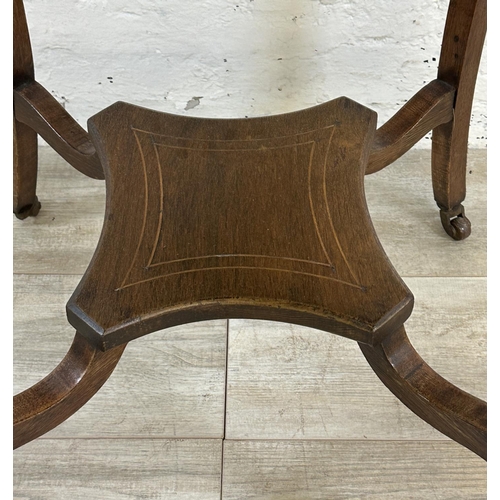 61 - A late 19th/early 20th century inlaid rosewood serpentine octagonal two tier side table - approx. 74... 